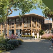 Architectural rendering of Zoo Miami's planned animal hospital, a low building with wooden louvered screens, surrounded by tropical planting and a guest pathway.