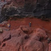 Conservation staff working on rocky island ground during the Desertas snail reintroduction