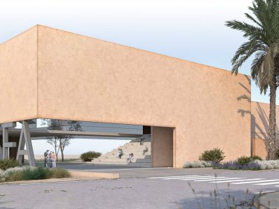 An architect's render of a long, low, sand-colored building with a wide open passage cut through its center, the word CETASEA in freestanding letters on the landscaping in front of it, palms and pine trees around it and a few small figures walking toward the entrance.