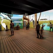 Rendering of a gallery where visitors stand on a plank floor surrounded by floor-to-ceiling projected wetland scenes of herons, egrets, sawgrass and open water.
