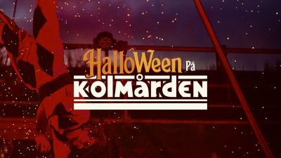 Promotional key art for Halloween at Kolmarden: a performer in a red and black harlequin costume hangs upside down from an aerial rig against a dark purple night sky lit with orange sparks, with the words Halloween pa Kolmarden set across the center in orange and white lettering.