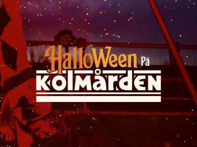 Promotional key art for Halloween at Kolmarden: a performer in a red and black harlequin costume hangs upside down from an aerial rig against a dark purple night sky lit with orange sparks, with the words Halloween pa Kolmarden set across the center in orange and white lettering.