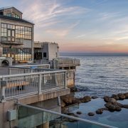 The Monterey Bay Aquarium's tide pool deck at sunset, with the open ocean to the right.