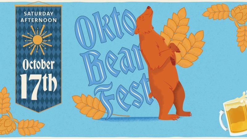 Illustrated promotional graphic for OktoBEARfest showing a brown bear standing upright holding hop vines, with a banner reading Saturday Afternoon October 17th and a stein of beer.