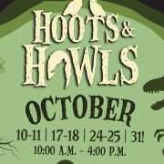 Promotional artwork for Hoots and Howls showing the event name in tall carved lettering across a bright green moon, with two white owls perched on the first word, a skeletal dinosaur standing at the right edge, a bare tree and a hanging spider at the left, and the text OCTOBER 10-11, 17-18, 24-25, 31 and 10:00 A.M. - 4:00 P.M. below, all set inside a dark purple border.