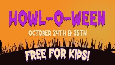 Promotional banner for Howl-O-Ween reading HOWL-O-WEEN, OCTOBER 24TH & 25TH and FREE FOR KIDS, in purple and green lettering on an orange sky, with black silhouettes of a goat in a witch's hat on the left and a rooster perched on the back of a horned animal wearing a crown on the right, above a dark grassy hill.