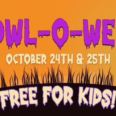 Promotional banner for Howl-O-Ween reading HOWL-O-WEEN, OCTOBER 24TH & 25TH and FREE FOR KIDS, in purple and green lettering on an orange sky, with black silhouettes of a goat in a witch's hat on the left and a rooster perched on the back of a horned animal wearing a crown on the right, above a dark grassy hill.