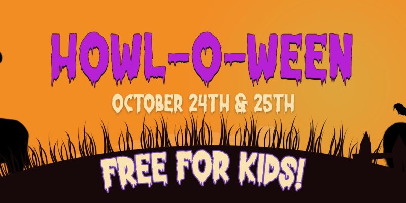 Promotional banner for Howl-O-Ween reading HOWL-O-WEEN, OCTOBER 24TH & 25TH and FREE FOR KIDS, in purple and green lettering on an orange sky, with black silhouettes of a goat in a witch's hat on the left and a rooster perched on the back of a horned animal wearing a crown on the right, above a dark grassy hill.