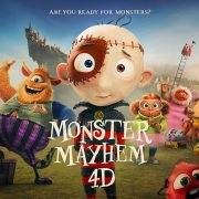 Promotional artwork for an animated film, showing a wide-eyed boy character stitched together from patches at center, a shaggy orange monster in purple striped trousers beside him and several smaller cartoon monsters across a green field, with a castle on a rocky crag behind. Lettering reads Monster Mayhem 4D and, above, Are You Ready For Monsters?