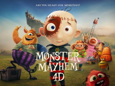 Promotional artwork for an animated film, showing a wide-eyed boy character stitched together from patches at center, a shaggy orange monster in purple striped trousers beside him and several smaller cartoon monsters across a green field, with a castle on a rocky crag behind. Lettering reads Monster Mayhem 4D and, above, Are You Ready For Monsters?